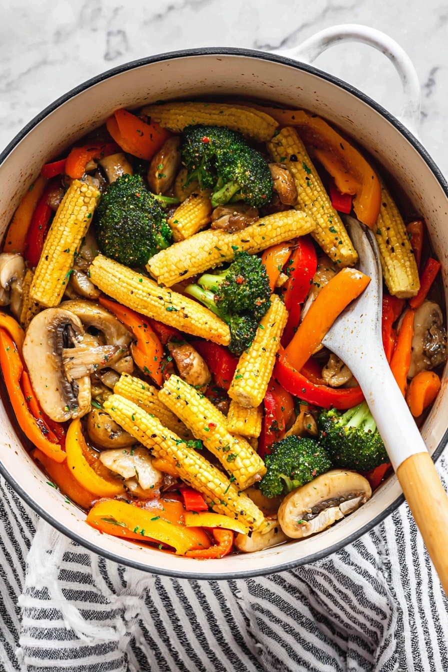 Vegetable Stir Fry with Savory Soy-Honey Sauce, stir fry vegetables recipe, quick healthy stir fry, Asian vegetable stir fry, flavorful vegetable dinner - A white pot holds a colorful mix of vegetables with three main layers: at the bottom are light brown sliced mushrooms with a tender texture, the middle layer shows bright green broccoli florets with a slightly rough surface, and the top layer is filled with long baby corn with a yellow bumpy surface, bright orange carrot slices, and strips of red and yellow bell peppers, all glistening with a light sauce and sprinkled with small green herb flakes and black pepper. A white spoon with a wooden handle is resting inside the pot, partly lifting some of the vegetables. The pot sits on a white marbled surface next to a white and black striped cloth. Photo taken with an iphone --ar 2:3 --v 7