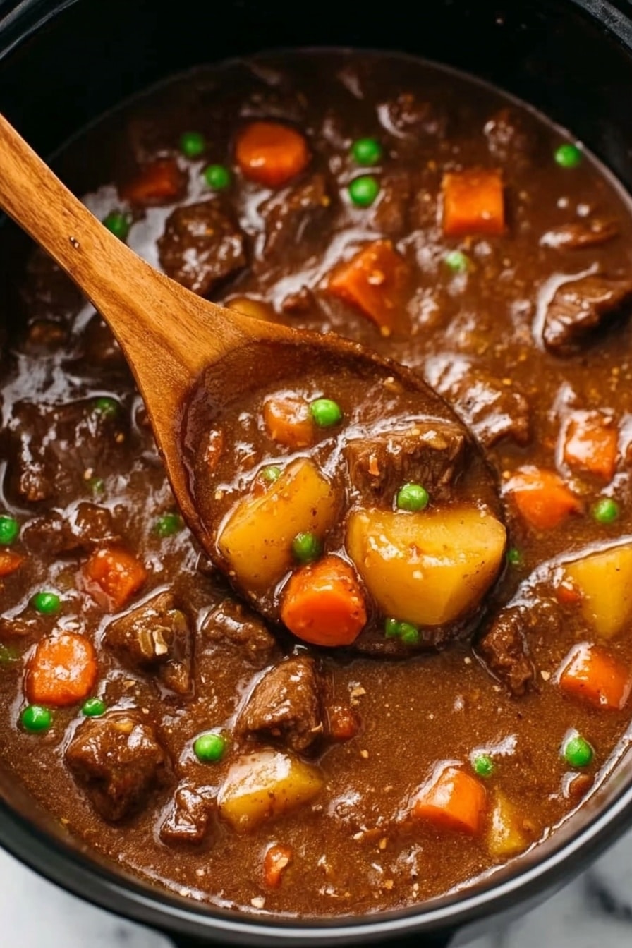 Slow Cooker Beef Stew, beef stew recipe, hearty beef stew, easy slow cooker meal, comforting beef stew - The image shows a close-up of beef stew in a black pot, filled with tender-looking chunks of brown beef, bright orange carrot pieces, small green peas, and yellow baby potatoes all mixed in a thick, glossy brown gravy. In the center, a wooden spoon scoops up some of the stew, revealing the chunky vegetables and meat soaked in rich sauce. The stew surface looks smooth with a hearty, comforting texture. The background is a white marbled surface. photo taken with an iphone --ar 2:3 --v 7