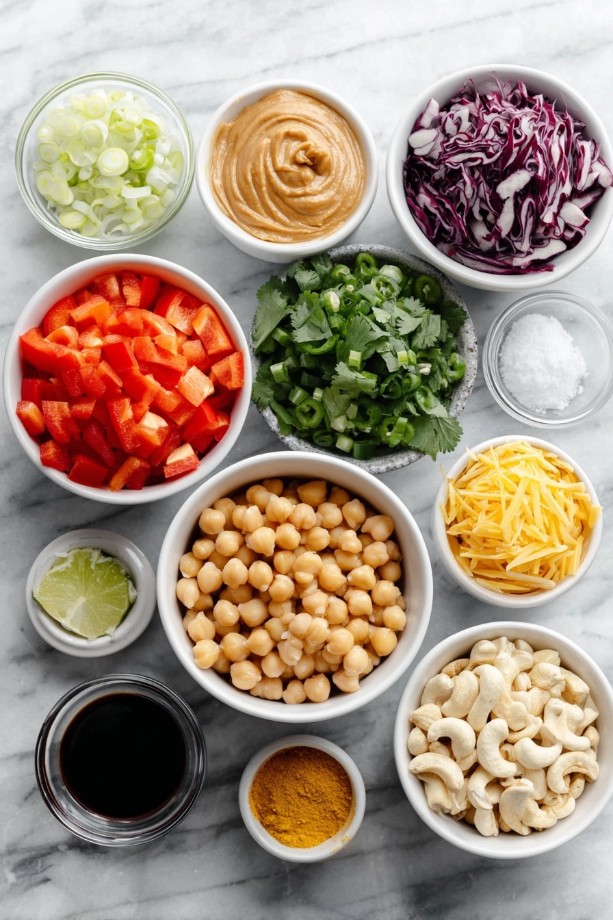 Chopped Thai-Inspired Chickpea Salad with Curry Peanut Dressing, Thai chickpea salad, healthy chickpea salad, Thai-inspired salads, vegan chickpea salad - Flat lay of a diced red bell pepper, a small mound of shredded bright orange carrots, a heap of chopped deep purple-red cabbage, a simple white ceramic bowl filled with plump rinsed chickpeas, a small pile of fresh cilantro leaves, thinly sliced green onions, a whole green jalapeño pepper with seeds visible, a small white bowl of creamy peanut butter, a small white bowl of freshly grated pale yellow ginger, a small white bowl containing minced white garlic, a small white bowl with fresh lime juice, a small white bowl of dark soy sauce, a small white bowl holding vibrant yellow curry powder, a small white bowl of bright red cayenne pepper powder, a small white bowl of golden ground turmeric, a small white bowl of roasted light brown cashews, all symmetrically arranged on a clean white marble surface, soft natural light, photo taken with an iPhone, professional food photography style, fresh ingredients, white ceramic bowls, no bottles, no duplicates, no utensils, no packaging --ar 2:3 --v 7 --p awthu7i m7354615311229779997