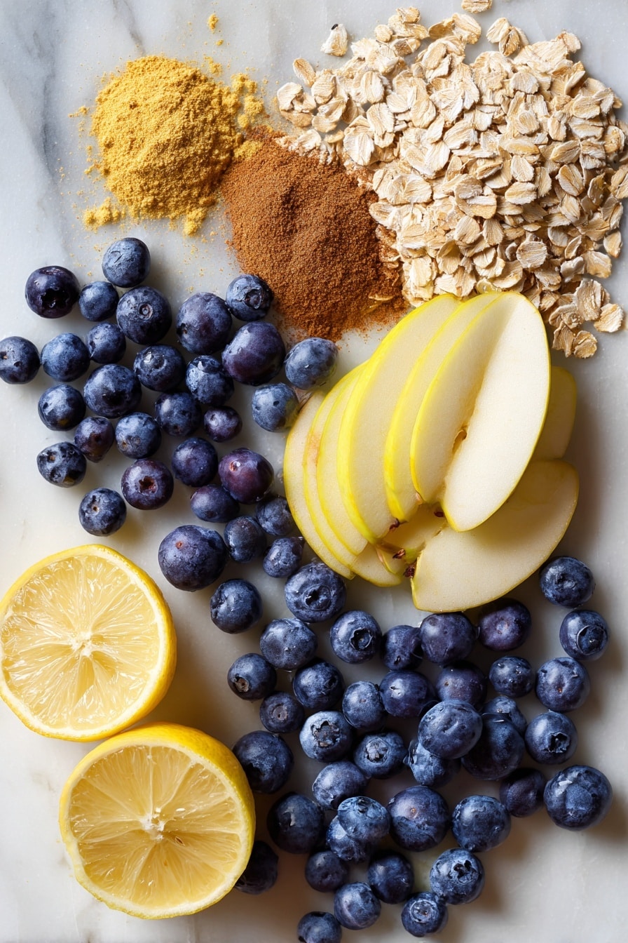 Apple and Blueberry Crumble, fruit crumble recipe, easy berry dessert, baked fruit crisp, cozy fall desserts - Flat lay of fresh plump blueberries with their deep blue and purple hues, thinly sliced crisp apples displaying their pale yellow flesh and smooth skin, light brown rolled oats scattered with their rough texture, packed brown sugar in rich caramel tones, golden melted vegan butter glistening softly, warm cinnamon powder in a small natural heap, and bright fresh lemon halves showing vibrant yellow and juicy segments, all beautifully arranged with natural spacing and overlapping layers, placed on white marbled surface, photo taken with an iphone --ar 2:3 --v 7