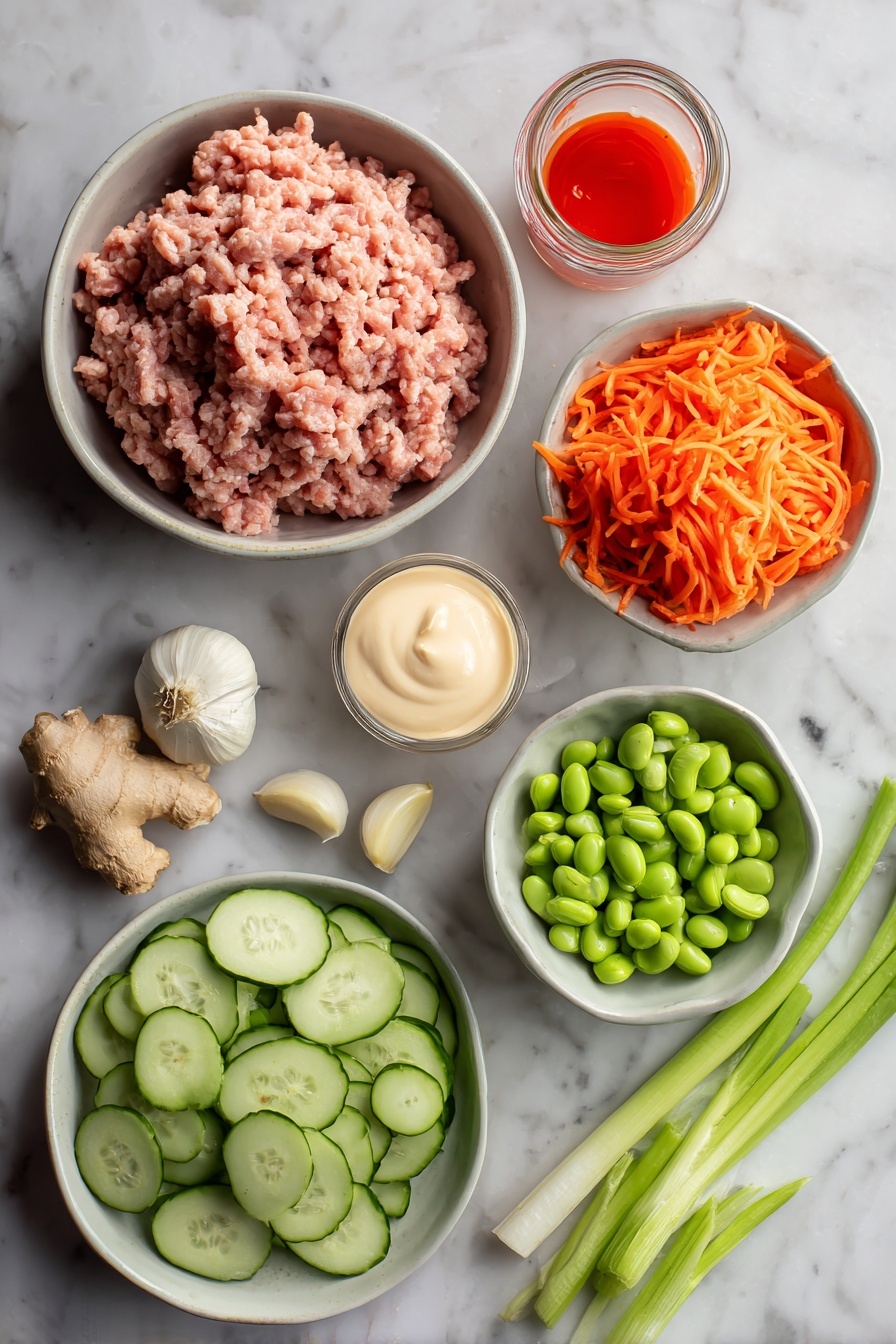 Ground Turkey Rice Bowls with Bang Bang Sauce, quick healthy dinner ideas, easy ground turkey recipes, flavorful rice bowl recipes, spicy bang bang sauce dishes - Flat lay of ground turkey raw and fresh, peeled garlic cloves, fresh ginger root with a small piece grated, bright orange shredded carrots, sliced green onions with vibrant green tops, sliced avocado with creamy green flesh, shelled edamame beans, small jar of creamy mayonnaise, and a small bowl of bright red sweet chili sauce with sriracha drizzle, all placed on a white marble surface, photo taken with an iphone --ar 2:3 --v 7