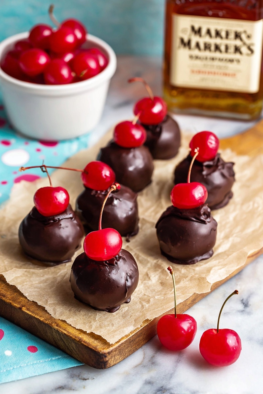 Cherry Bourbon Balls, Bourbon Truffles, Cherry Chocolate Bites, Holiday Treats, Boozy Candy - The image shows eight small round chocolate balls placed on light brown parchment paper over a white marbled surface. Each chocolate ball is topped with a shiny red cherry, some with stems attached, creating a bright red spot on the dark brown textured chocolate. Two extra shiny red cherries with long stems rest on the parchment paper near the chocolate balls. To the left, there is a small white bowl filled with more bright red cherries, and in the background, there is an out-of-focus Maker's Mark whiskey bottle on a wooden board, adding warm amber tones to the scene. The overall setting has a soft light blue cloth with white polka dots beneath the items, giving a fresh and inviting look. Photo taken with an iphone --ar 2:3 --v 7