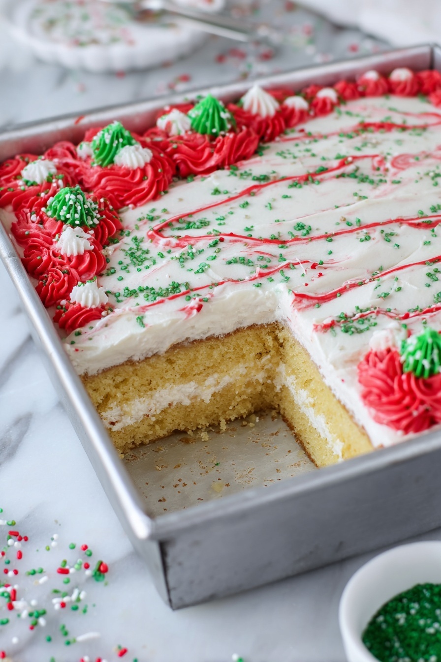 Christmas Tree Sheet Cake with White Chocolate Frosting, festive holiday cake, Christmas dessert, white chocolate cake recipe, holiday sheet cake - The image shows a square cake in a silver metal pan with a piece taken out from one corner, revealing two layers of golden-yellow cake separated by a thick white cream layer. The top layer of the cake is smooth and covered with white frosting, decorated with thin red lines curving across the surface, green sugar sprinkles scattered evenly, and clusters of red frosting rosettes at the edges with additional green and white sprinkle pieces on top. The pan is placed on a white marbled surface with a small white bowl containing green sugar nearby and some scattered red, green, and white sprinkles around. photo taken with an iphone --ar 2:3 --v 7