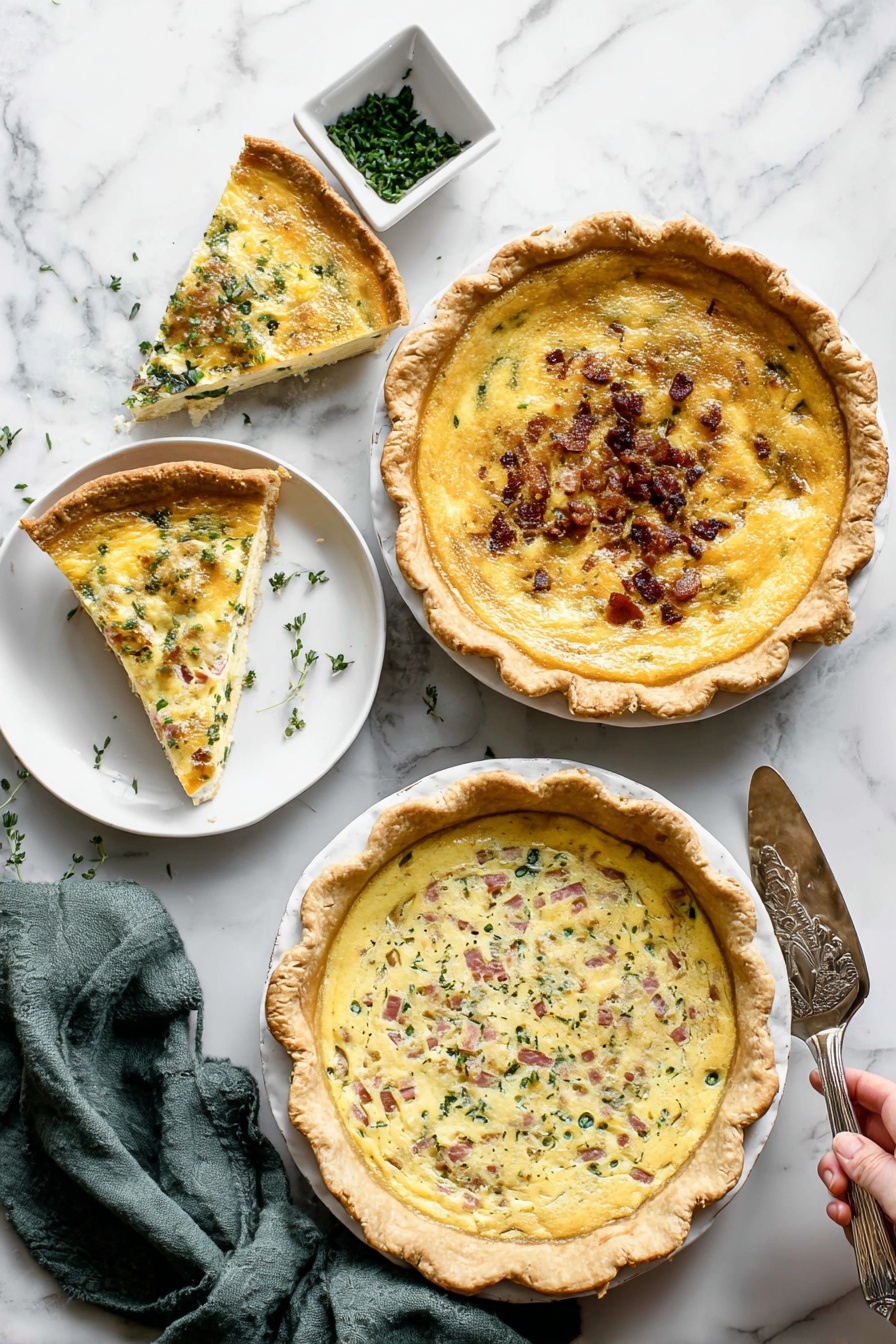 Cheese Quiche, savory pie recipe, easy cheese quiche, breakfast quiche, flaky crust quiche - The image shows three quiches on a white marbled surface. The top right quiche has a golden yellow smooth filling with a slightly browned top and a thick golden crust; one slice is missing and placed on a small white plate beside it. The middle left quiche has a creamy yellow filling with small green herbs and bits of browned bacon sprinkled on top, with a thick golden crust. The bottom right quiche has a mixed filling of creamy yellow with green leafy vegetables and pink ham chunks scattered inside, topped with melted cheese and a golden crust. Nearby, a white square dish with chopped green herbs and an olive green cloth napkin are visible. A woman's hand holding a silver serving spatula is resting on the surface near the top right quiche. Photo taken with an iphone --ar 2:3 --v 7