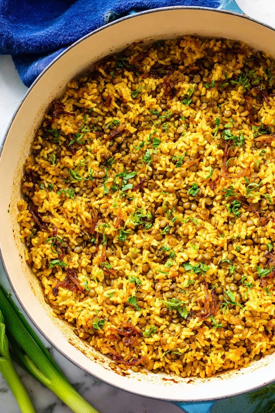 Mujadara Lentils and Rice, Middle Eastern lentil dish, easy lentil and rice recipe, comforting vegetarian meal, caramelized onion dish - The image shows a white round pot filled with a mixed dish made of cooked yellow rice and small green lentils, combined with pieces of light brown caramelized onions and chopped green herbs scattered throughout. The texture looks soft and slightly moist with some grains sticking together and a few small charred spots seen inside the pot. The pot is placed on a white marbled surface with a blue cloth partly visible under its handle, and some green onions lay next to the pot on the lower left side. The lighting highlights the warm golden tones of the rice and the fresh green color of the herbs, creating a vibrant and appetizing look. photo taken with an iphone --ar 2:3 --v 7