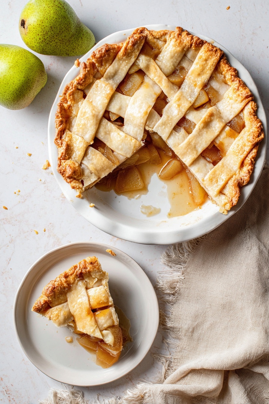 Vegan Pear Pie with Chai Spices, vegan pear pie, chai spiced dessert, dairy-free fruit pie, autumn vegan dessert - A round pie with a golden brown lattice crust sits on a white plate, showing a soft, slightly shiny filling of sliced pears and cinnamon sauce underneath. One large slice is missing from the pie, revealing the thick fruit filling and some sauce spilling onto the plate. The crust edges are crimped with a slightly darker golden tone. Next to the pie is a smaller white dish with a single slice of the pie, showing the same layers clearly. The scene is on a white marbled surface, with two whole green pears in the top left corner and a soft beige cloth napkin with frayed edges near the bottom left. photo taken with an iphone --ar 2:3 --v 7