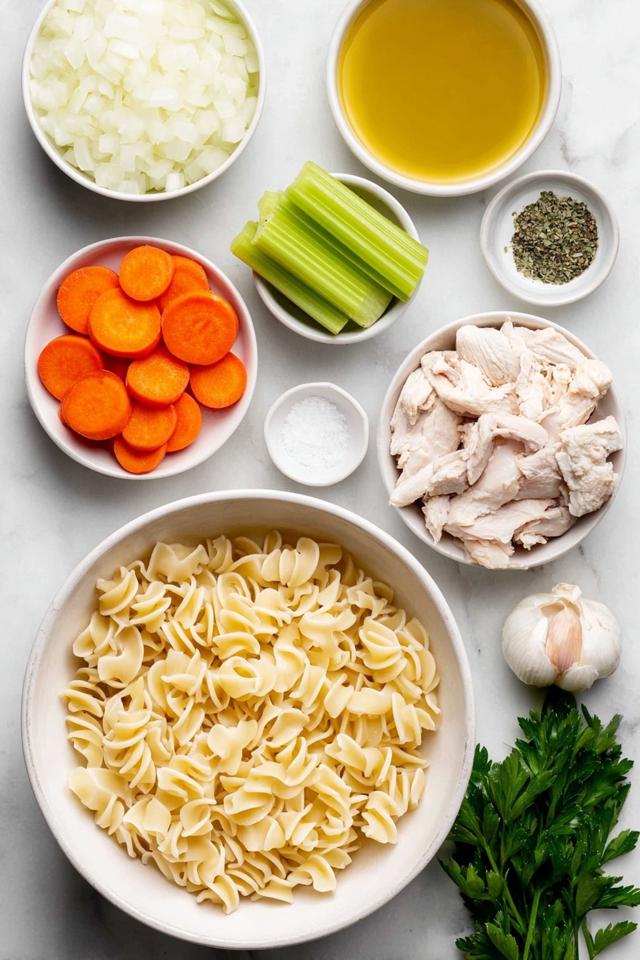 Vegan Chicken Noodle Soup, plant-based chicken noodle soup, hearty vegan soup recipes, vegan comfort food, easy vegan noodle soup - Flat lay of a small white ceramic bowl of golden olive oil, a large white ceramic bowl filled with chopped white onion, a few cloves of whole unpeeled garlic, three bright green celery stalks sliced, three peeled and sliced vibrant orange carrots, a small white ceramic bowl of dried green basil, a small white ceramic bowl of dried thyme, chopped vegan chicken pieces resembling small beige chunks, uncooked gigli pasta with its twisted funnel shape arranged neatly, a small white ceramic bowl of coarse salt crystals, a small white ceramic bowl of cracked black peppercorns, and a small bunch of fresh green parsley sprigs, all placed on a clean white marble surface, soft natural light, photo taken with an iPhone, professional food photography style, fresh ingredients, white ceramic bowls, no bottles, no duplicates, no utensils, no packaging --ar 2:3 --v 7 --p m7354615311229779997