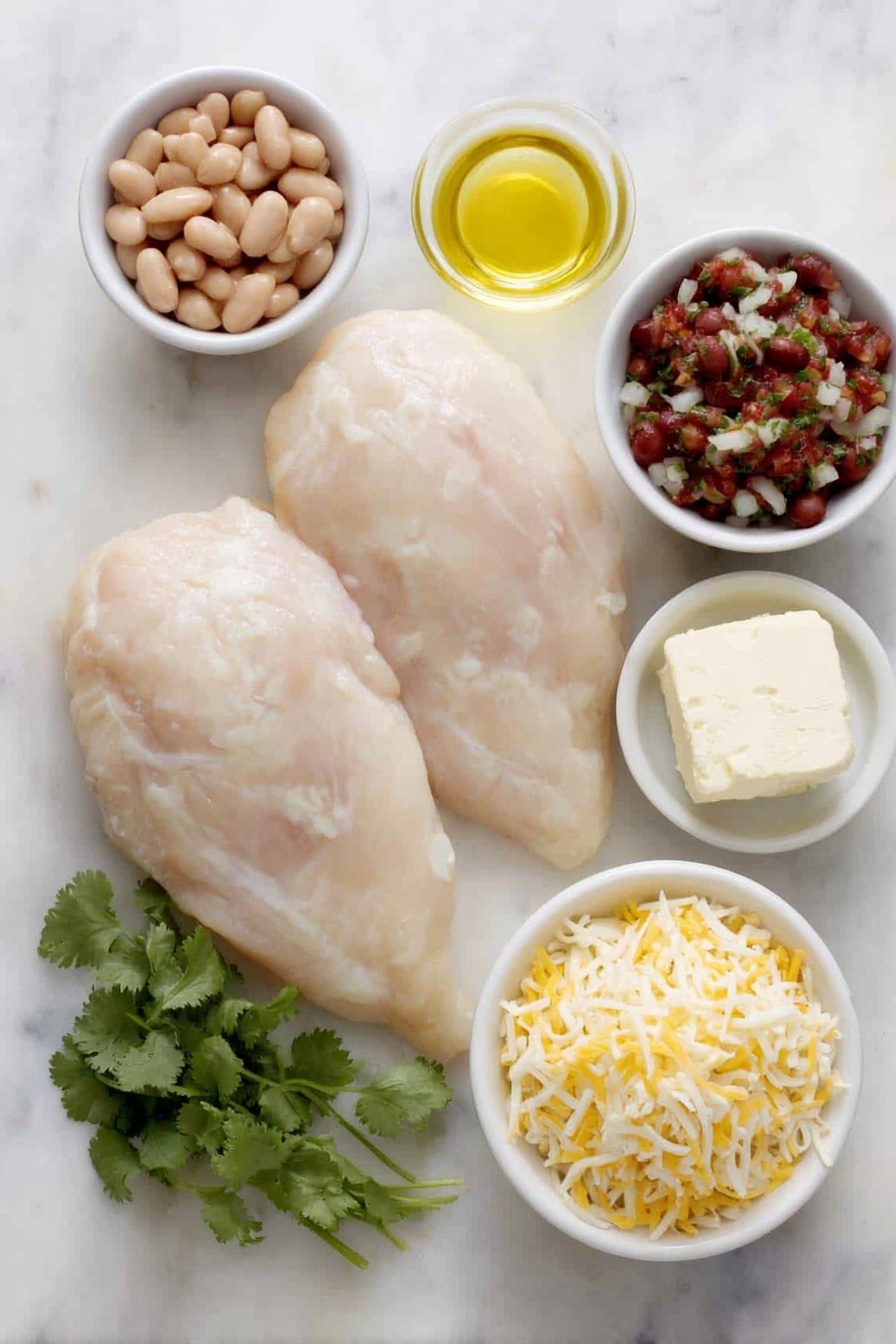 Salsa Chicken Bake, quick chicken casserole, easy dinner recipe, cheesy baked chicken, flavorful weeknight dinner - Flat lay of two large raw boneless skinless chicken breasts, a small white bowl of orange-red taco seasoning powder, a small white bowl of golden olive oil, a block of creamy white cream cheese, a small white bowl filled with smooth light brown refried beans, a small white bowl of chunky red salsa with visible tomato and herbs, a small white bowl with shredded pale yellow cheddar cheese, a small white bowl with shredded white Monterey Jack cheese, and a few fresh bright green cilantro sprigs arranged neatly — all placed on a clean white marble surface, soft natural light, photo taken with an iPhone, professional food photography style, fresh ingredients, white ceramic bowls, no bottles, no duplicates, no utensils, no packaging --ar 2:3 --v 7 --p m7354615311229779997