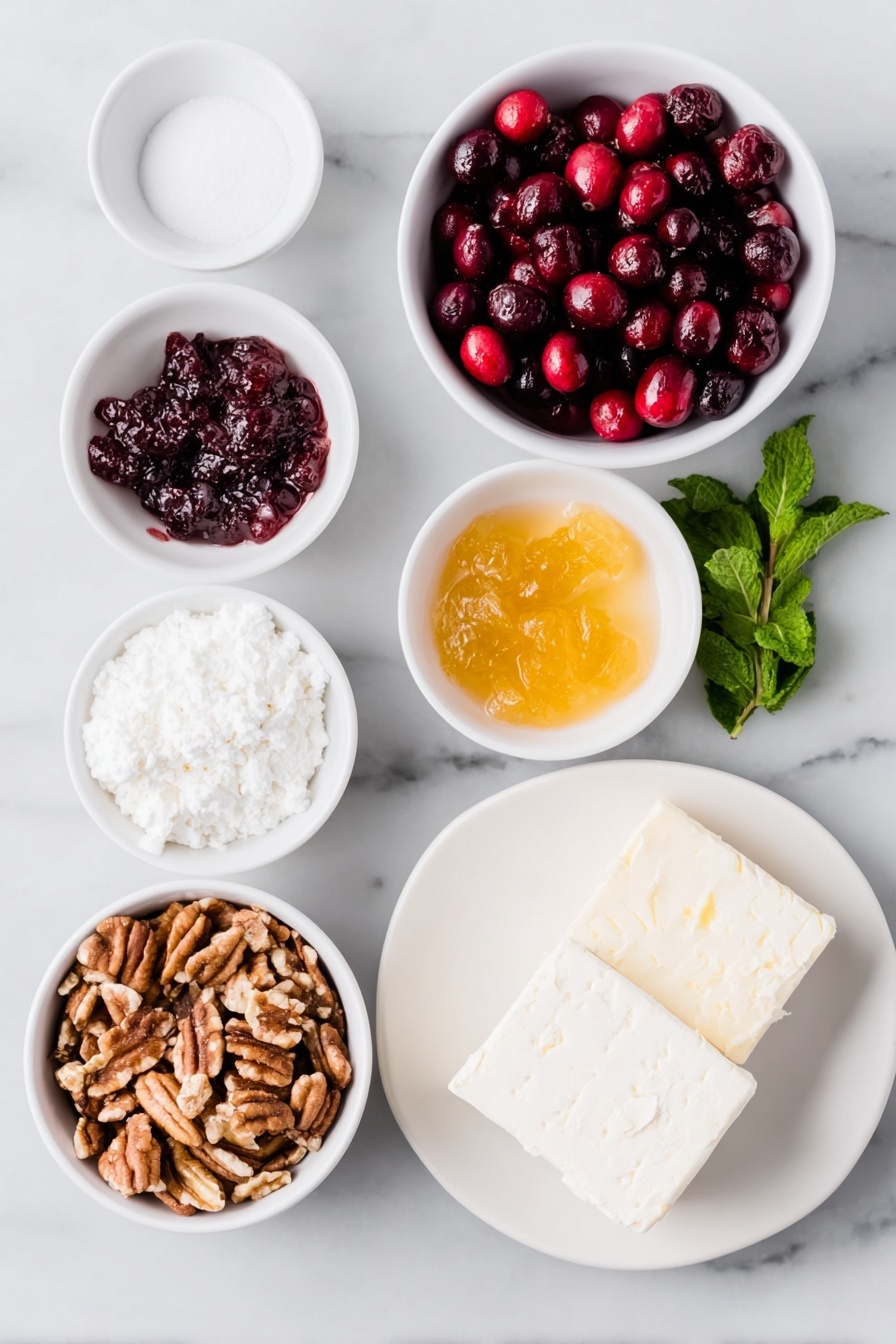 Cranberry Cream Cheese Dip, holiday appetizer ideas, easy holiday dips, cranberry cheese dip recipe, festive party dips - Flat lay of fresh whole cranberries, a small white bowl of white sugar, a small white bowl of golden apricot preserves, a small white bowl of clear water, a small pile of chopped pecans, two blocks of smooth cream cheese with clean edges, a few buttery crackers, and a sprig of fresh mint, all arranged in perfect symmetry on simple white ceramic dishes and plates, placed on a clean white marble surface, soft natural light, photo taken with an iPhone, professional food photography style, fresh ingredients, white ceramic bowls, no bottles, no duplicates, no utensils, no packaging --ar 2:3 --v 7 --p m7354615311229779997