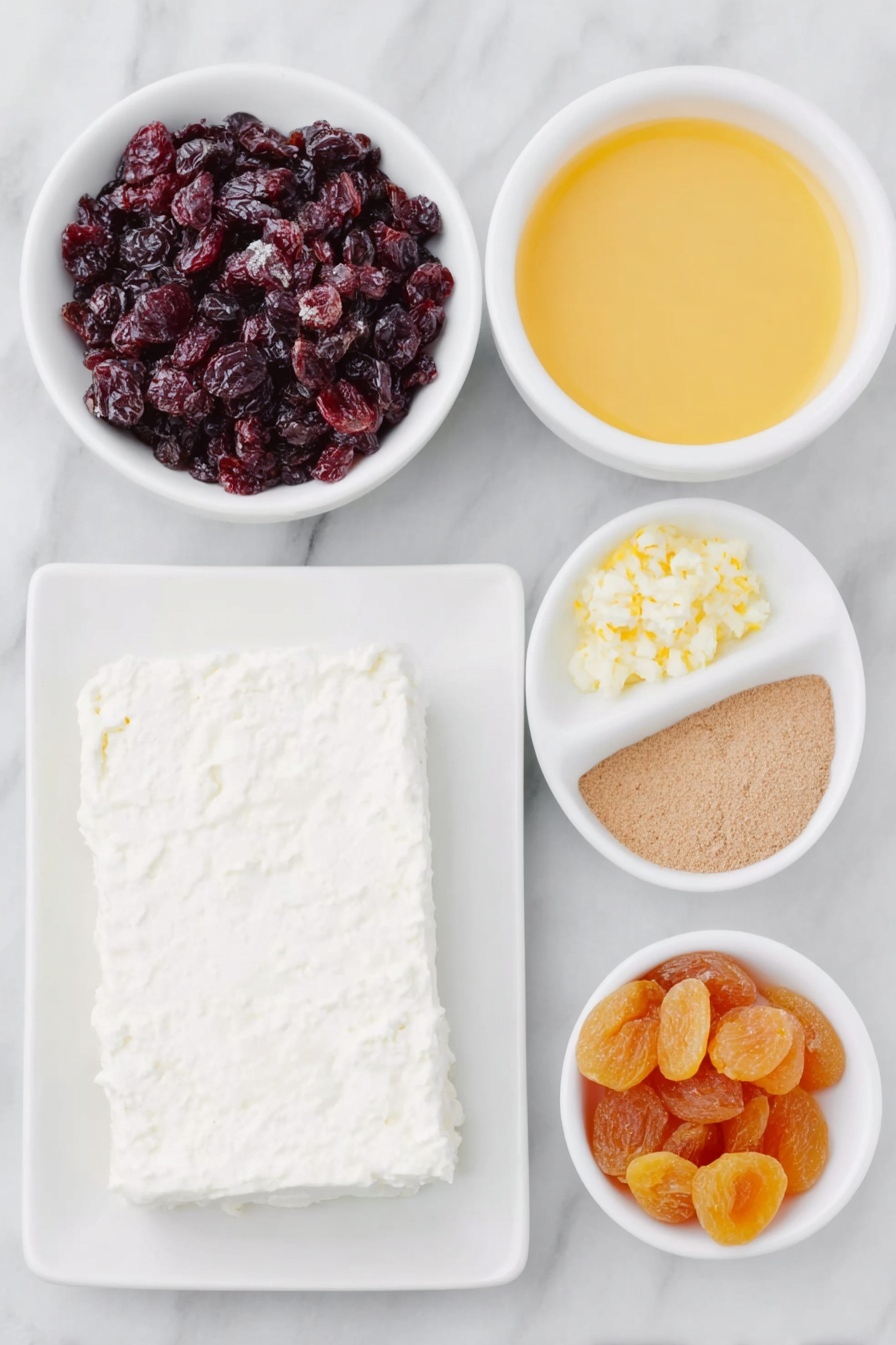 Cranberry Orange Cream Cheese Spread, quick fruit spreads, holiday appetizer ideas, creamy fruit spreads, easy brunch recipes - Flat lay of a block of fresh cream cheese on a simple white ceramic plate, a small white bowl filled with bright red chopped dried cranberries, a small white bowl with vibrant orange chopped dried apricots, another small white bowl containing fresh orange juice, a small white bowl with finely grated orange zest, and a tiny white bowl holding ground ginger powder, all arranged in perfect symmetry, placed on a clean white marble surface, soft natural light, photo taken with an iPhone, professional food photography style, fresh ingredients, white ceramic bowls, no bottles, no duplicates, no utensils, no packaging --ar 2:3 --v 7 --p m7354615311229779997