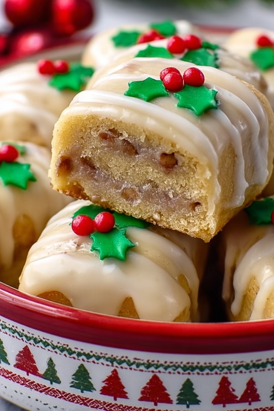 Gingerbread Cookie Log Rolls, festive gingerbread log rolls, homemade gingerbread Christmas treats, holiday gingerbread cookies, Nutella-lime gingerbread logs - A stack of square cookies with a light golden color and visible thin layers of a slightly darker filling inside, each topped with a thin, shiny glaze that looks creamy and smooth. On top of the front cookie, there is a small decoration made from green and red icing shaped like holly leaves and red berries. The cookies are placed inside a round white tin with a red pattern of reindeer and geometric shapes around the outside. The background shows more cookies and a white marbled surface beneath the tin. photo taken with an iphone --ar 2:3 --v 7