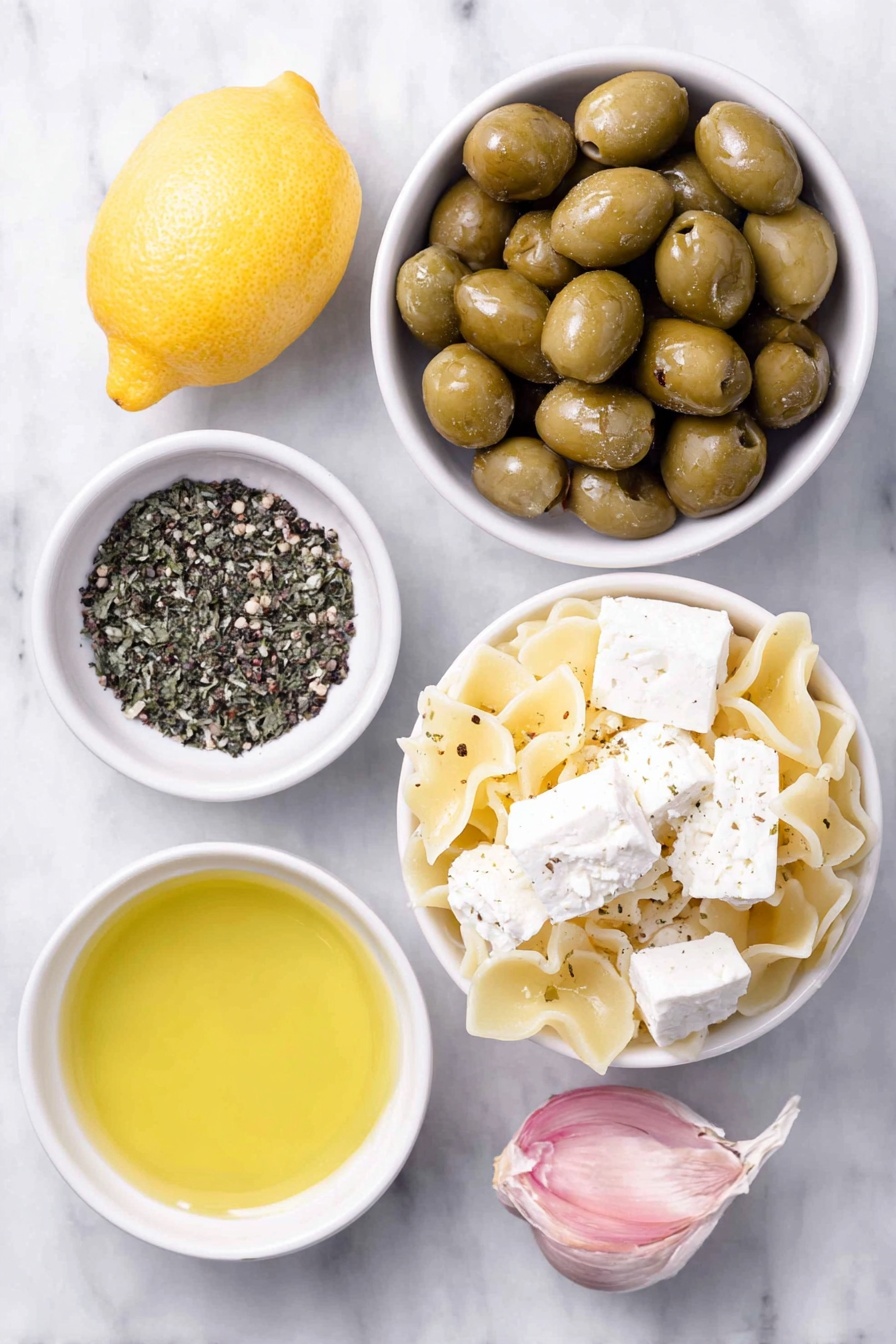 Dirty Martini Pasta Salad, pasta salad with olives and feta, flavorful cocktail-inspired pasta dish, easy summer pasta salad, if you love martinis - Flat lay of cooked mafalda corta pasta, a small pile of roughly chopped large green olives, cubed feta cheese, a small white bowl of extra virgin olive oil, a small white bowl of olive brine, a whole unpeeled clove of fresh garlic, a whole fresh lemon, a small white bowl of freshly cracked black pepper placed on a clean white marble surface, soft natural light, photo taken with an iPhone, professional food photography style, fresh ingredients, white ceramic bowls, no bottles, no duplicates, no utensils, no packaging --ar 2:3 --v 7 --p m7354615311229779997