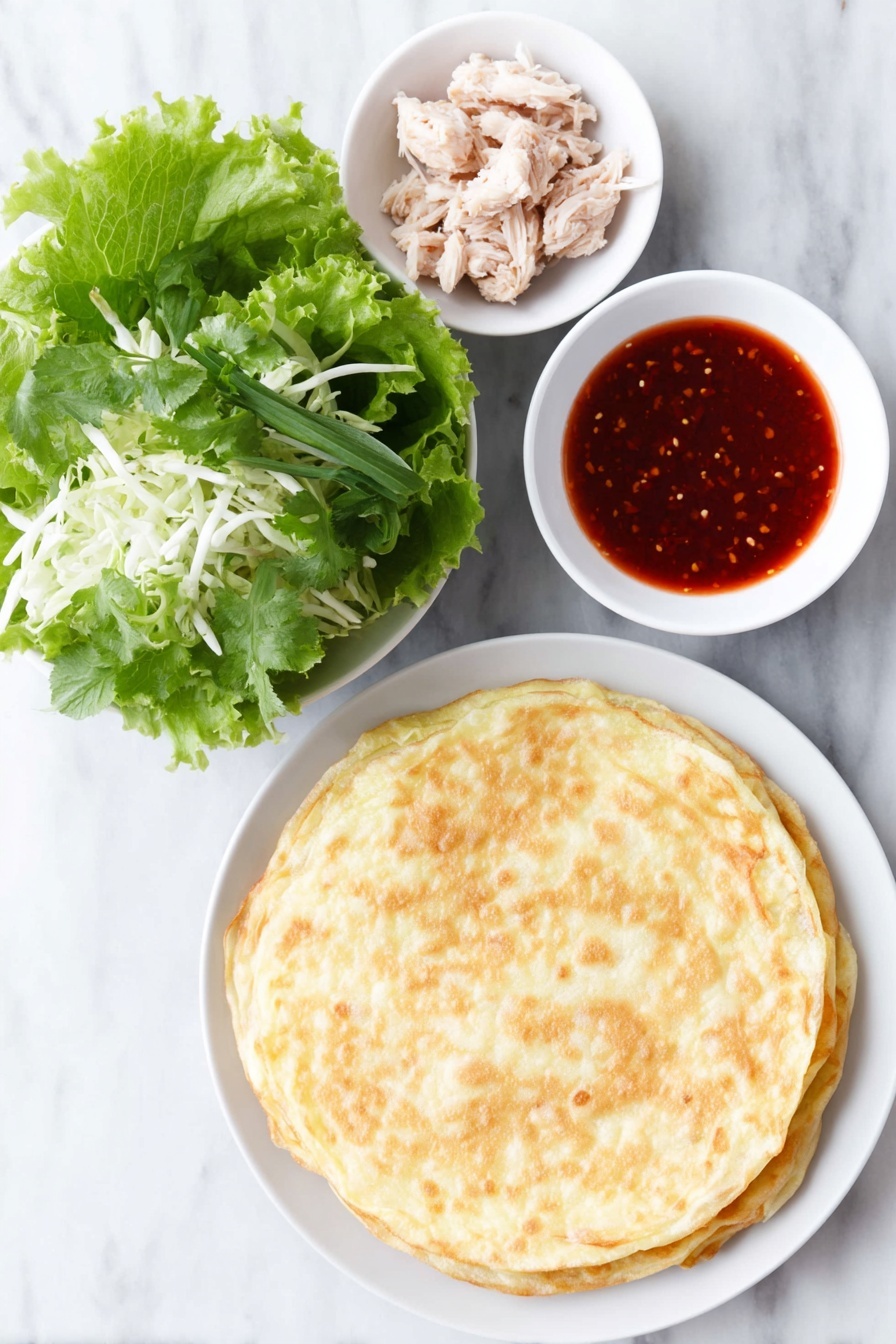 Crunch Chicken Salad on Crispy Egg Roll Base, Asian chicken salad recipe, crispy egg roll chicken salad, easy Asian salad with crispy shell, quick chicken salad appetizer - Flat lay of a crisp stack of golden fried egg roll wrappers, a heap of fresh mixed Asian salad greens with shredded cabbage, a few whole cooked chicken tenders glistening with bright red sweet chili sauce, and a small white ceramic bowl filled with glossy sweet chili sauce, all arranged in perfect symmetry on a simple white ceramic plate and bowls, placed on a clean white marble surface, soft natural light, photo taken with an iPhone, professional food photography style, fresh ingredients, white ceramic bowls, no bottles, no duplicates, no utensils, no packaging --ar 2:3 --v 7 --p m7354615311229779997