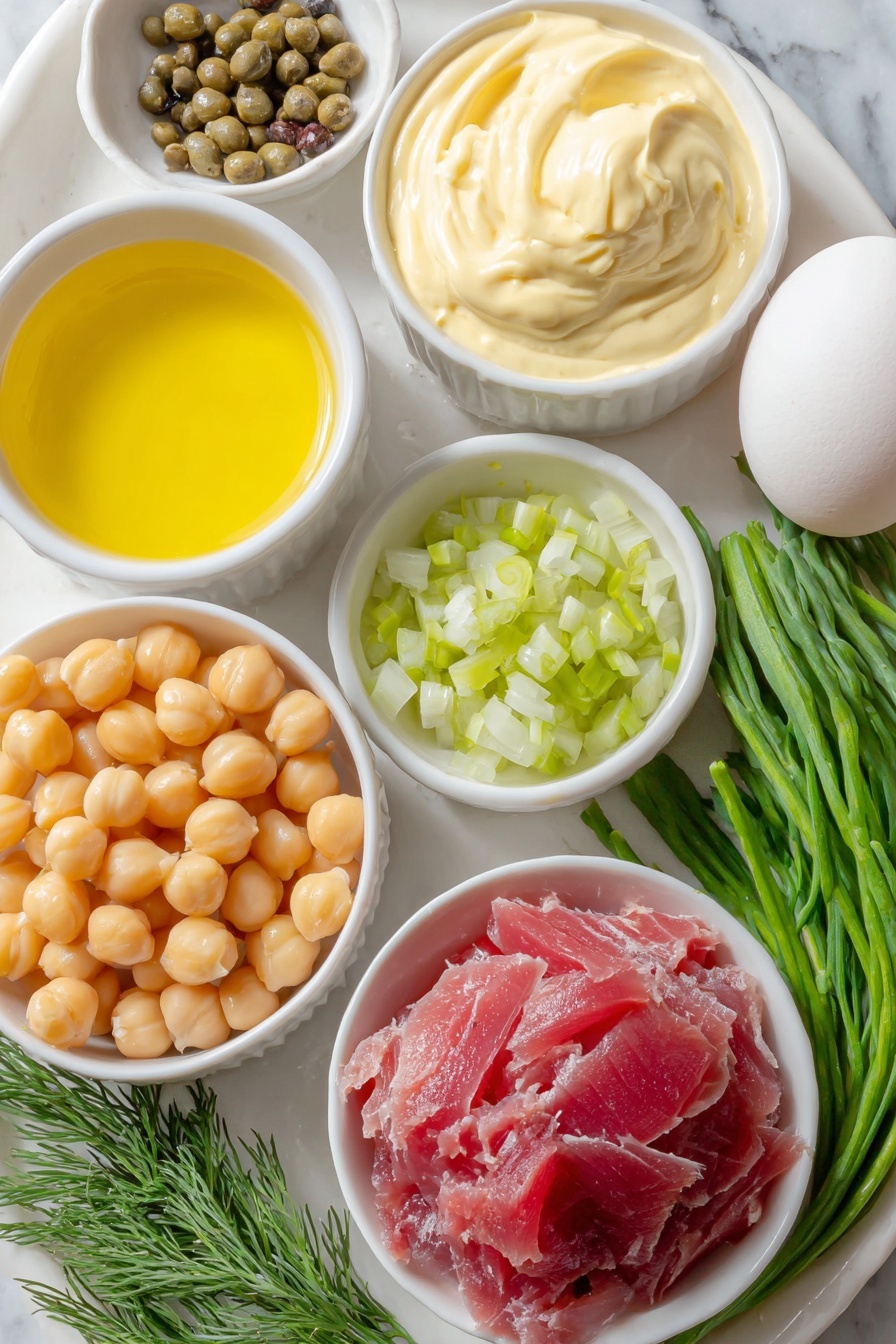 Healthy Tuna Chickpea Salad, healthy tuna chickpea salad, nutritious tuna salad, light tuna and chickpea dish, protein-packed salad - Flat lay of a small pile of shiny light beige chickpeas, a simple white ceramic bowl with creamy mayonnaise, a small white bowl of golden olive oil, a small white bowl with bright yellow fresh lemon juice, a small white bowl holding smooth dijon mustard, a few fresh green dill sprigs, a small heap of finely chopped pale green celery, a small amount of finely minced bright purple-red onion, a small mound of briny green capers, a small flaky pile of light pink tuna, a small white bowl with ground black pepper, and a whole clean white egg with uncracked shell, all arranged in perfect symmetry on a clean white ceramic plate and bowls, placed on a clean white marble surface, soft natural light, photo taken with an iPhone, professional food photography style, fresh ingredients, white ceramic bowls, no bottles, no duplicates, no utensils, no packaging --ar 2:3 --v 7 --p m7354615311229779997