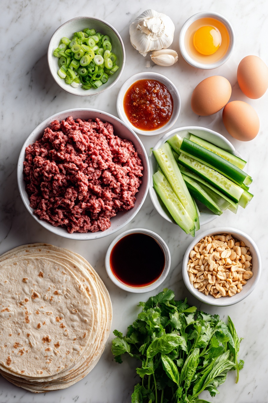 Thai Basil Beef Wraps, Thai Basil Beef Wraps recipe, easy Thai beef wraps, quick Thai beef meal, flavorful Thai beef wraps - Flat lay of fresh ground beef in a simple white ceramic bowl, whole uncracked brown eggs beside it, four cloves of peeled garlic, a small mound of freshly grated ginger root, a small white bowl of dark tamari sauce, a small white bowl of bright red Thai chili sauce, two chopped green onions with white and green parts visible, four Persian cucumbers chopped into rounds, a bunch of vibrant green cilantro leaves, a small bunch of deep green Thai basil leaves, a small white bowl filled with chopped roasted peanuts, a stack of warm flour tortillas neatly arranged, a small white bowl of chili paste, and a small white bowl of toasted sesame oil all evenly spaced with perfect symmetry placed on a clean white marble surface, soft natural light, photo taken with an iPhone, professional food photography style, fresh ingredients, white ceramic bowls, no bottles, no duplicates, no utensils, no packaging --ar 2:3 --v 7 --p m7354615311229779997